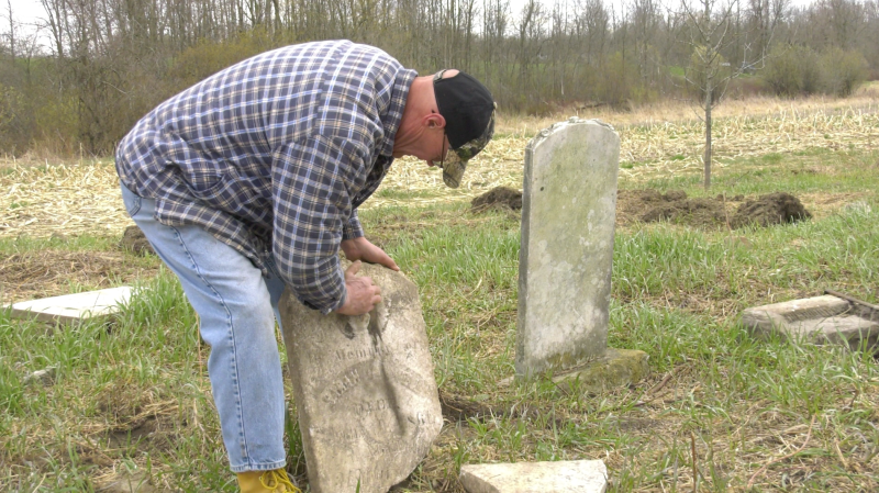 John Kruis has spent five weeks cleaning up a long abandoned cemetery near Brockville.  (Nathan Vandermeer/CTV News Ottawa)