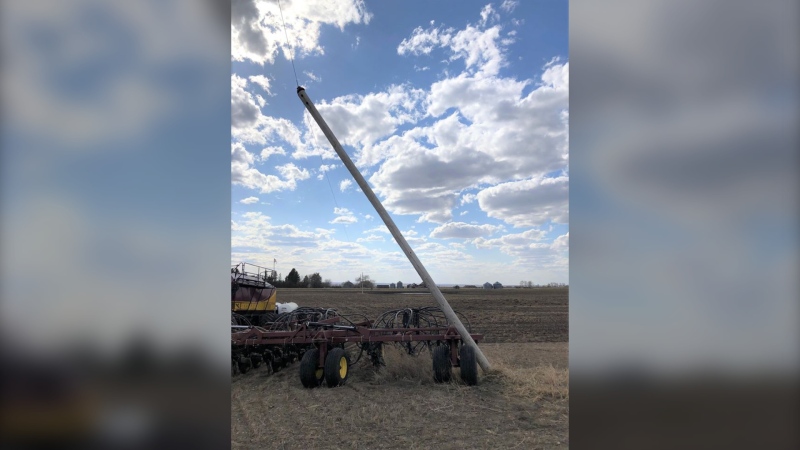An air seeder came into contact with a power pole in May 2020 (Supplied: SaskPower)