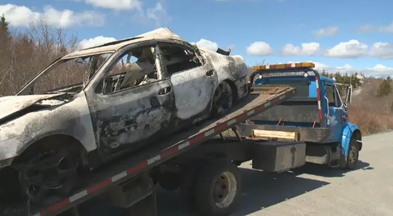 A burned-out car is seen in Hammonds Plains, N.S., on May 13, 2020.