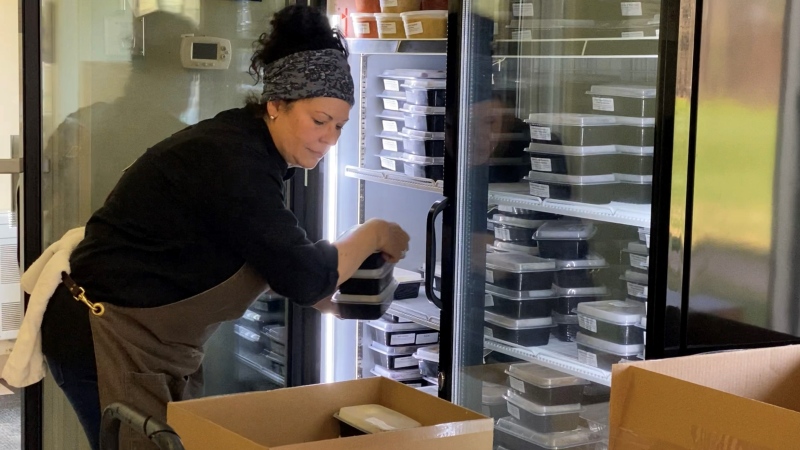 Marcie’s Café owner Jo-Ann Laverty is packing meals she prepared for community agencies. Ottawa, ON. May 14, 2020. (Tyler Fleming / CTV News Ottawa)