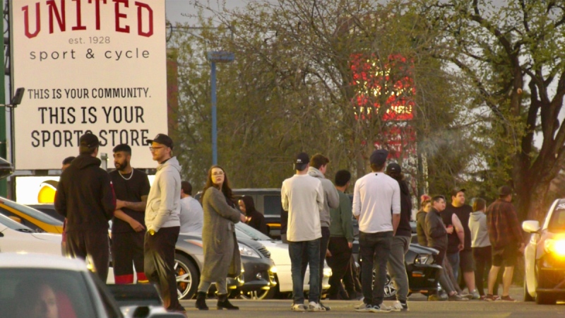 Approximately 200 people held a car meet on Whyte Avenue Wednesday, May 13, 2020 despite the province's ban on large gatherings of 15 people or more. . (Sean Amato/CTV News Edmonton)