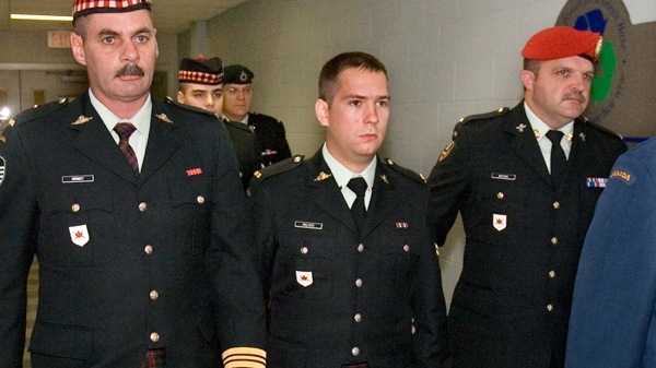Cpl. Matthew Wilcox is escorted from the courtroon during a break in proceedings in Sydney, N.S., on Tuesday, Sept. 30, 2009. (Andrew Vaughan / THE CANADIAN PRESS)