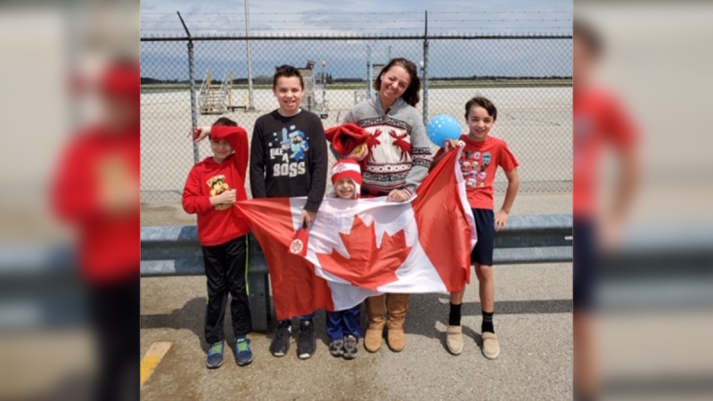 Members of the Powers family gather to greet the Snowbirds in London, Ont. on Sunday, May 10, 2020 in this supplied photo.