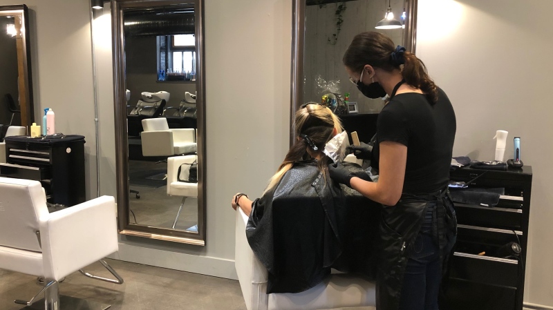 Hair stylists use masks while working with clients on May 19 (Katherine Hill / CTV News Regina)