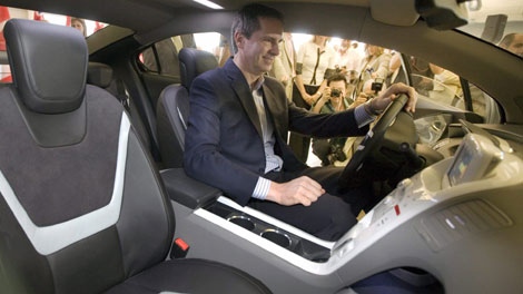 Ontario Premier Dalton McGuinty sits behind the wheel of a Chevrolet Volt during a press conference in Toronto on Wednesday, July 15, 2009 to announce support for Ontarians buying electric vehicles. (THE CANADIAN PRESS/Darren Calabrese)
