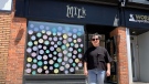 Co-owner Inaas Kiryakos stands in front of Milk boutique in the ByWard Market, reopening after being forced to close due to a fire and COVID-19. (Saron Fanel/CTV News Ottawa) 