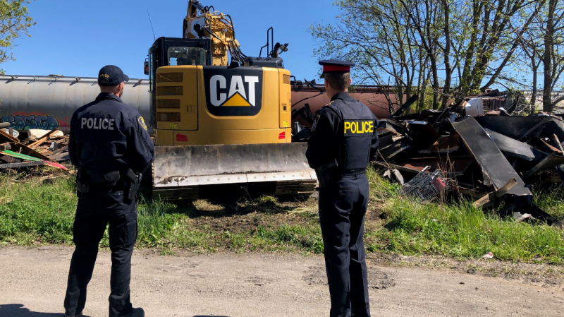 Police survey the deconstruction of an abandoned building in St. Thomas on Thursday, May 21, 2020. (Source: St. Thomas Police)