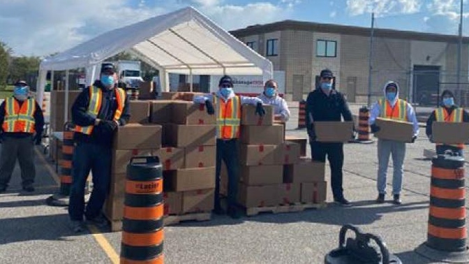 Members of the Rosati Group at the Windsor Lifeline Outreach food bank (courtesy Rosati Group/AM800)