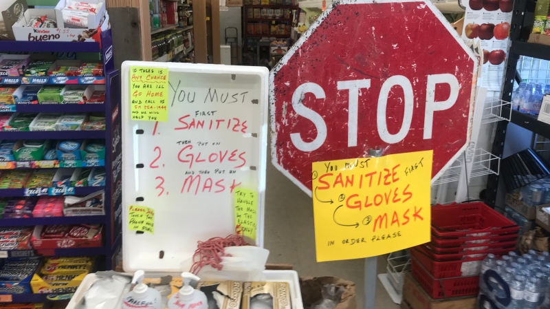 Customers at west-end grocer Giglio’s Market are greeted with a new policy requiring them to use hand sanitizer, wear gloves and a face mask on May 26, 2020. (Rich Garton / CTV Windsor)