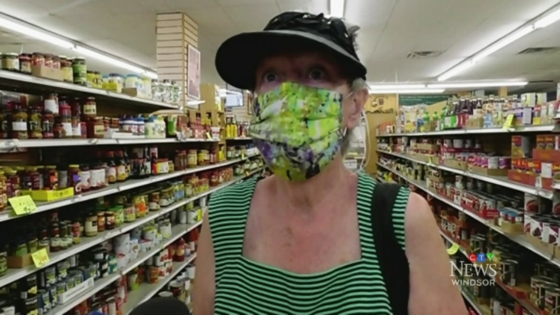 Ccustomer Jude Quick wears a cloth mask to shop at Giglio’s Market in west Windsor, Ont., on May 26, 2020. (Rich Garton / CTV Windsor)