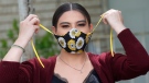 In this Monday, May 18, 2020, photo, Anissa Archuleta wears her mask at her home in Midvale, Utah. (AP Photo/Rick Bowmer)