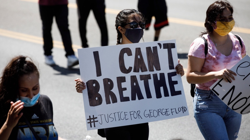 People protesting the death of George Floyd in Minneapolis police custody march in San Jose, Calif., Friday, May 29, 2020. (Dai Sugano/Bay Area News Group via AP)