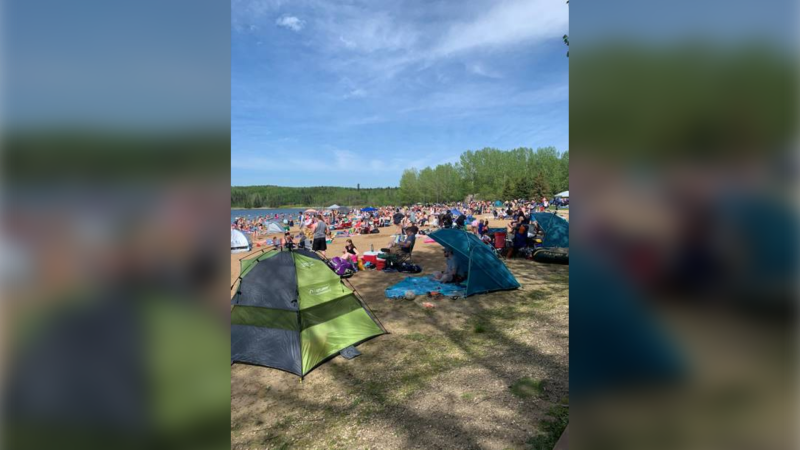 A photo taken Saturday, May 30 2020 at the Wabamun Lake Provincial Park showed the beach filled with people. (Supplied)