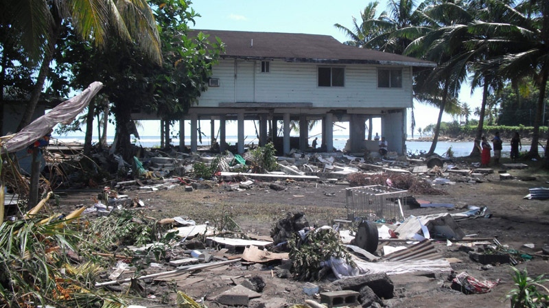 A home stands missing it's first floor amid debris after a tsunami struck in Leone, American Samoa, Wednesday, Sept. 30, 2009. (AP / Raj Borsellino)