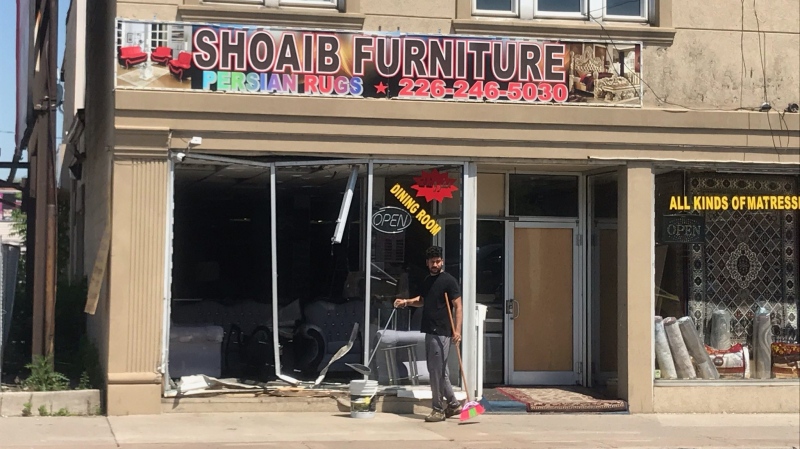 Officers responded to the crash at Shoaib Furniture at 760 Wyandotte St. E. in Windsor, Ont., on Tuesday, June 2, 2020. (Michelle Maluske / CTV Windsor)