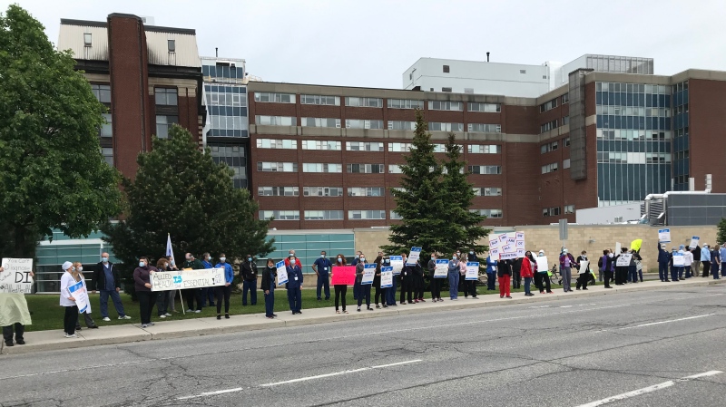 Front-line workers rally outside in Ottawa calling on the Ontario government to expand its pandemic pay bump to more workers. (Leah Larocque / CTV News Ottawa)
