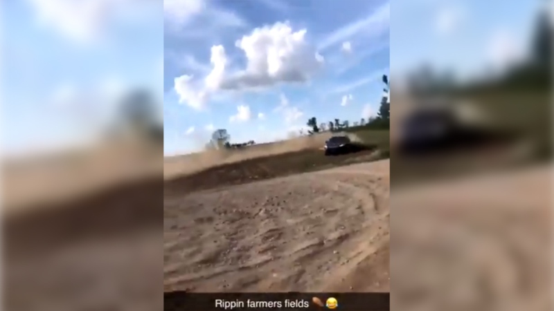 This image taken from video shows vehicles damaging a newly planted cornfield near Delaware, Ont. (@katelyn_fife / Twittter)