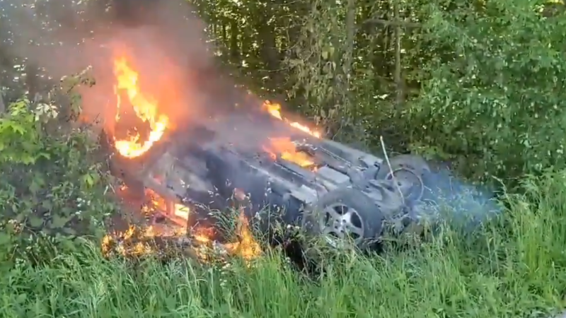 A car burst into flames after rolling into a ditch in Norfolk County Sunday afternoon. (Courtesy Norfolk OPP) 