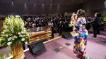 A singer performs by the casket of George Floydduring a funeral service for Floyd at The Fountain of Praise church Tuesday, June 9, 2020, in Houston. (AP Photo/David J. Phillip, Pool)