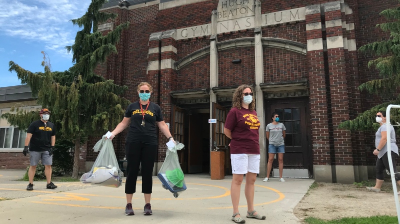 Teachers volunteer to bag up what students left behind at school in Windsor, Ont., on Tuesday, June 9, 2020. (Michelle Maluske / CTV Windsor)