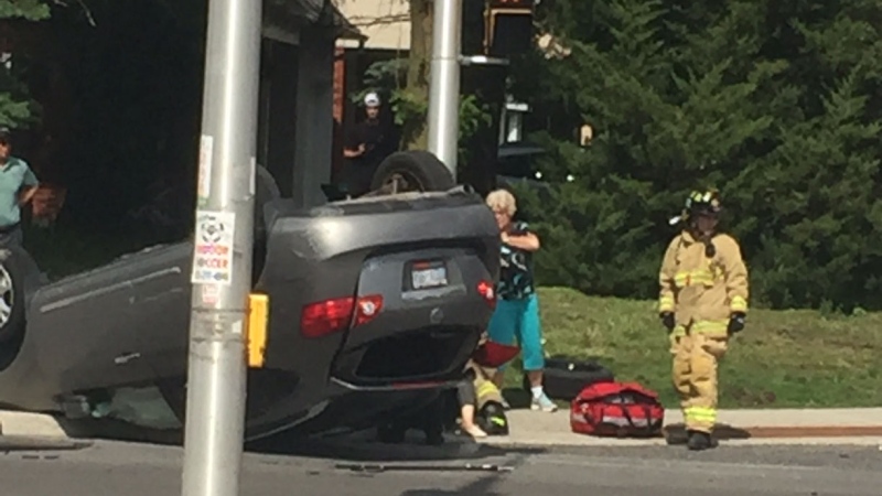First responders attend the scene of a two-vehicle collision at Greenbank Road and Malvern Drive in Ottawa at around 3:40 p.m. Tuesday, June 9, 2020. One car had rolled onto its roof. (Susan/CTV Viewer)