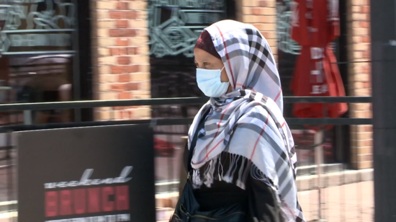 A woman wears a mask in Ottawa's ByWard Market. 