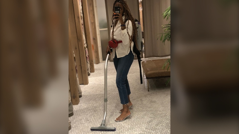 Associate manager Karissa Lewis vacuums the Aritzia store at the Yorkdale Shopping Centre outside Toronto in August 2019, a task she didn’t see other managers perform. 