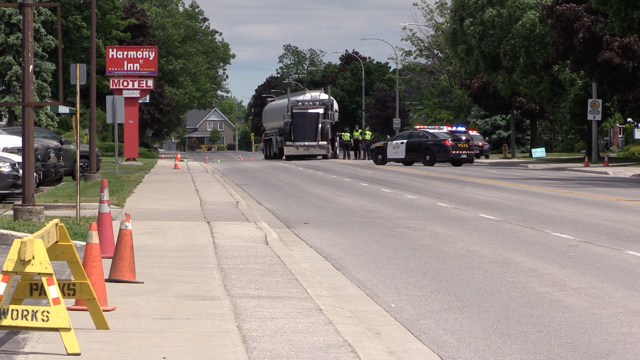 OPP work at the scene of a collision involving a transport truck and a pedestrian in Goderich, Ont. on Thursday, June 11, 2020. (Scott Miller / CTV London)