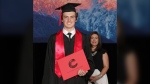 Carson Graham Secondary student Max Faber receives his high school diploma standing two metres away from Principal Suzette Dohm, a result of COVID-19 precautions that dramatically changed what graduation looked like for students in 2020. 