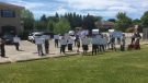 Protesters gather outside the office of London West MP Kate Young Sunday June 14, 2020 (Brent Lale / CTV News)