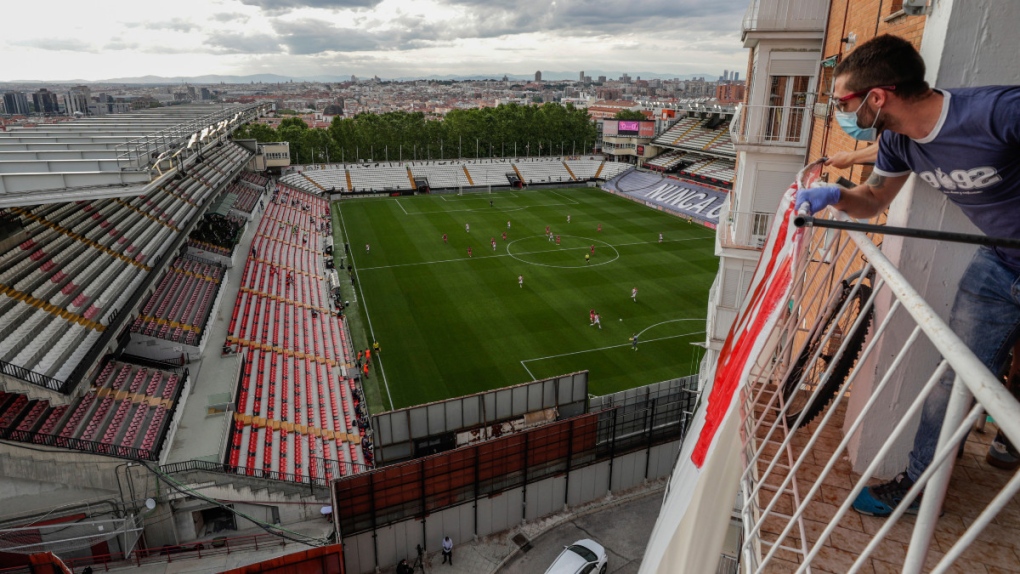 Watching soccer from a balcony in Madrid