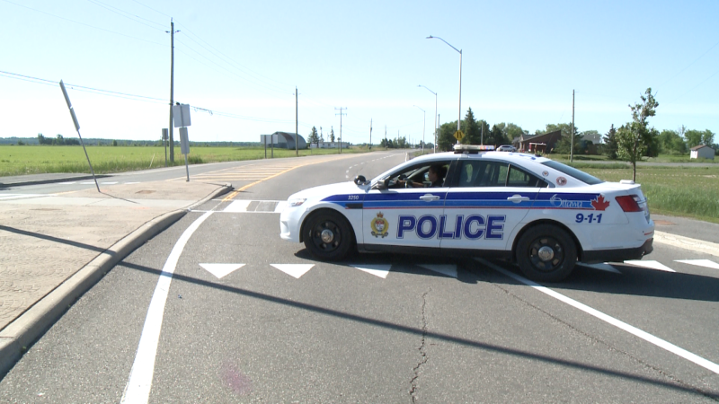 A police vehicle blocks traffic at the scene of a motorcycle crash at Trim and Wall roads in Orléans on June 15, 2020. A man in his 40s suffered life-threatening injuries.