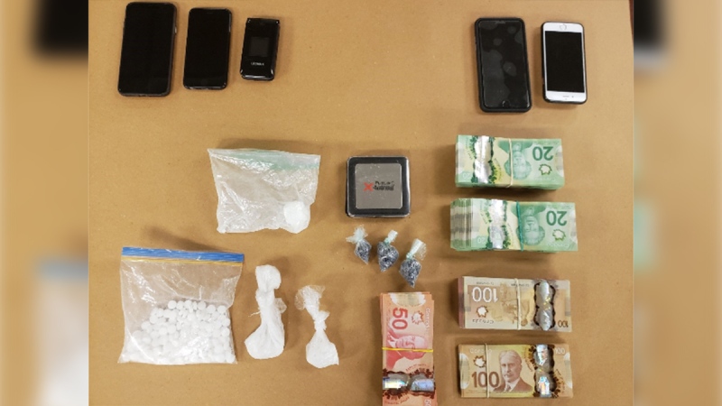 Drugs, cash and cell phones seized in London, Ont. on Saturday, June 13, 2020 are seen in this image released by the London Police Service.