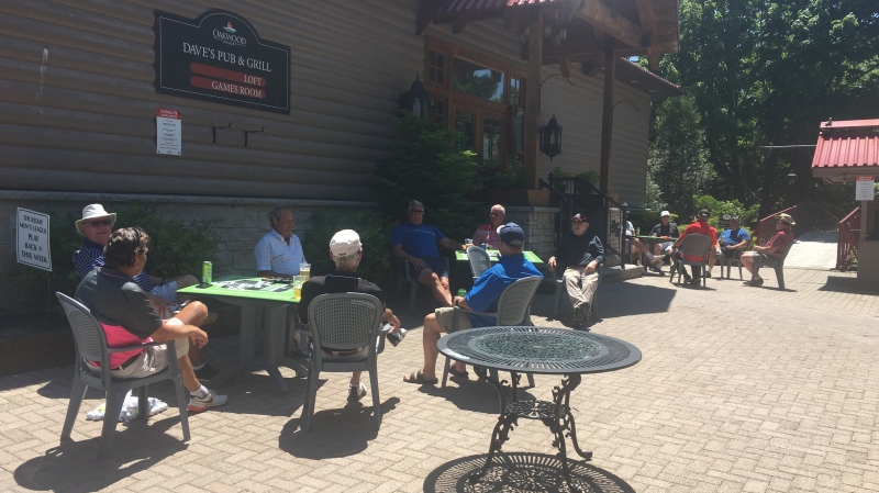 Golfers enjoy the patio at Oakwood Resort in Huron County, Ont. on Monday, June 15, 2020. (Brent Lale / CTV London)