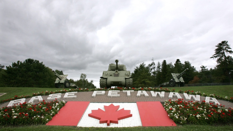 Grey skies loom over the main gate at Canadian Forces Base Petawawa, Ont. Monday, Sept. 4, 2006. (Jonathan Hayward / THE CANADIAN PRESS)