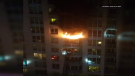 A fire burns on a seventh-floor balcony at 234 Rideau St. Sat., June 20, 2020. (Photo courtesy: Kate Dalgleish)