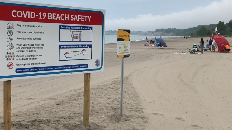 A new sign outlines pandemic beach safety at a Port Stanley, Ont. beach on Monday, June 22, 2020. (Sean Irvine / CTV News)
