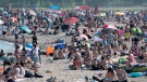 Thousands of people spend time on Woodbine Beach in Toronto on Saturday June 20, 2020. THE CANADIAN PRESS/Frank Gunn