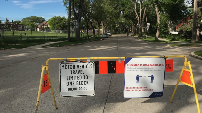 A temporary barrier at Wolseley Ave. and Clifton St. identifying the road as one of the city’s enhanced active transportation routes. (Source: Josh Crabb/ CTV News Winnipeg)