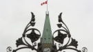 The Peace Tower on Parliament Hill is framed by the iron gates in Ottawa, Ont., on Wednesday, Sept. 16, 2009. (Sean Kilpatrick / THE CANADIAN PRESS)