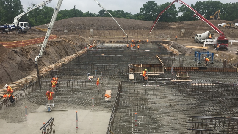 Concrete foundation being poured at the former Alma College site (Brent Lale / CTV News)