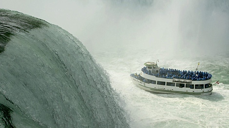 The Maid of the Mist navigates the turbulent waters of the lower Niagara river at the base of Horseshoe Falls, as seen from Niagara Falls State Park in Niagara Falls, N.Y. on Friday, Sept. 28, 2007. (AP Photo/Don Heupel)