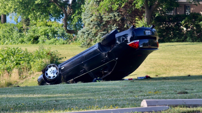 A car rolled over on Riverside Drive near Pillette Road in Windsor, Ont., on Sunday, June 28, 2020. (Courtesy OnLocation / Twitter)