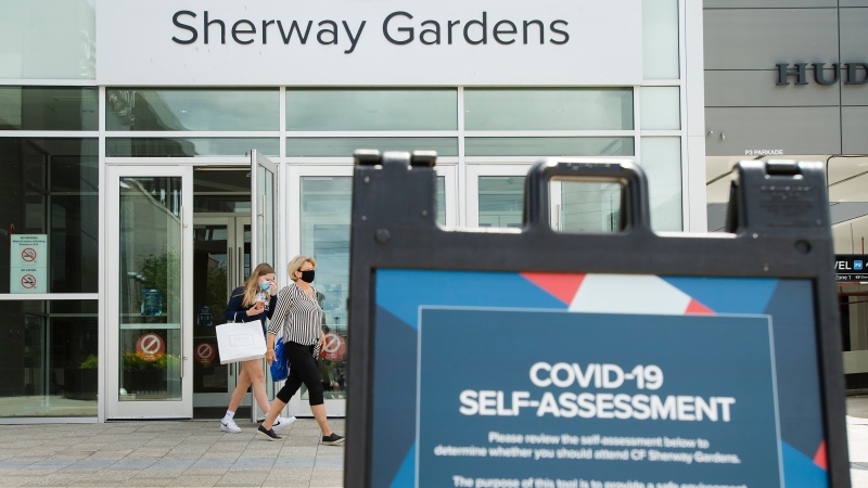 People leave Sherway Gardens shopping mall during the COVID-19 pandemic in Toronto on Wednesday, June 24, 2020. Toronto and the GTA entered stage two of opening. (Nathan Denette/The Canadian Press)
