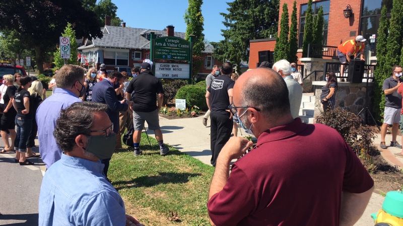 Small businesses owners and residents hold a rally while stuck in Stage 1 of reopening in Kingsville, Ont., on Tuesday, June 30, 2020. (Chris Campbell / CTV Windsor)