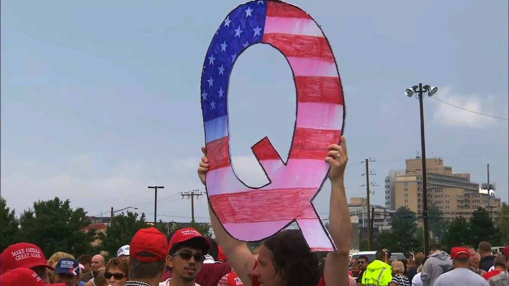 qanon-conspiracy-theory-followers-step-out-of-the-shadows-and-may-be