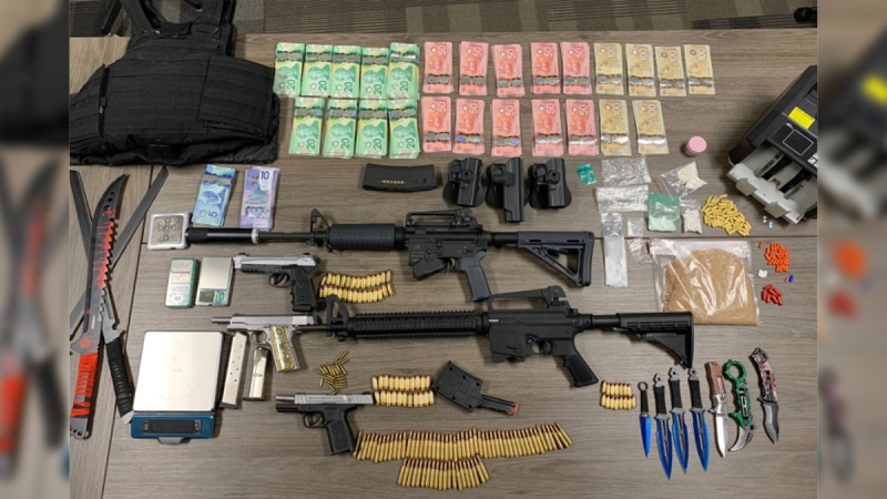 Drugs, weapons and cash seized in St. Thomas, Ont. on Thursday, July 2, 2020 are seen in this image released by the St. Thomas Police Service.