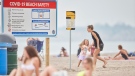 Large signs for COVID-19 beach safety are prominently displayed at the beach in Port Stanley, Ont., on Monday, June 22, 2020. Beaches in Southwestern Ontario opened for the first time on Monday after being closed due COVID-19 restrictions. Attendance was low on the first morning but overcast weather and threat of thunder storms was not conducive to enticing large crowds. THE CANADIAN PRESS/Geoff Robins