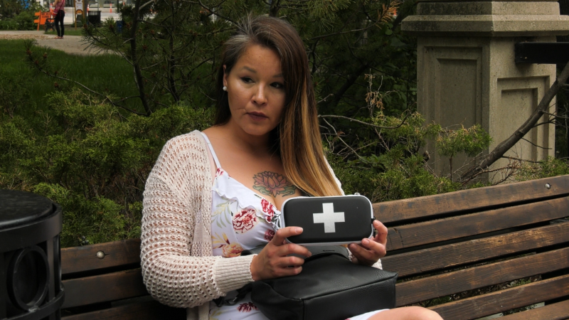 Krista Shore holds a naloxone kit in Regina. Shore encourages more people to keep kits around. (Marc Smith/CTV News Regina)