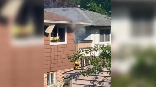 Firefighters work to contain a basement fire on Jalna Boulevard on Sunday, July 5, 2020. (Viewer video)